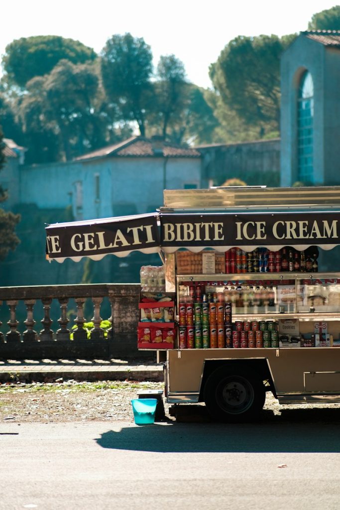 an ice cream truck parked on the side of the road